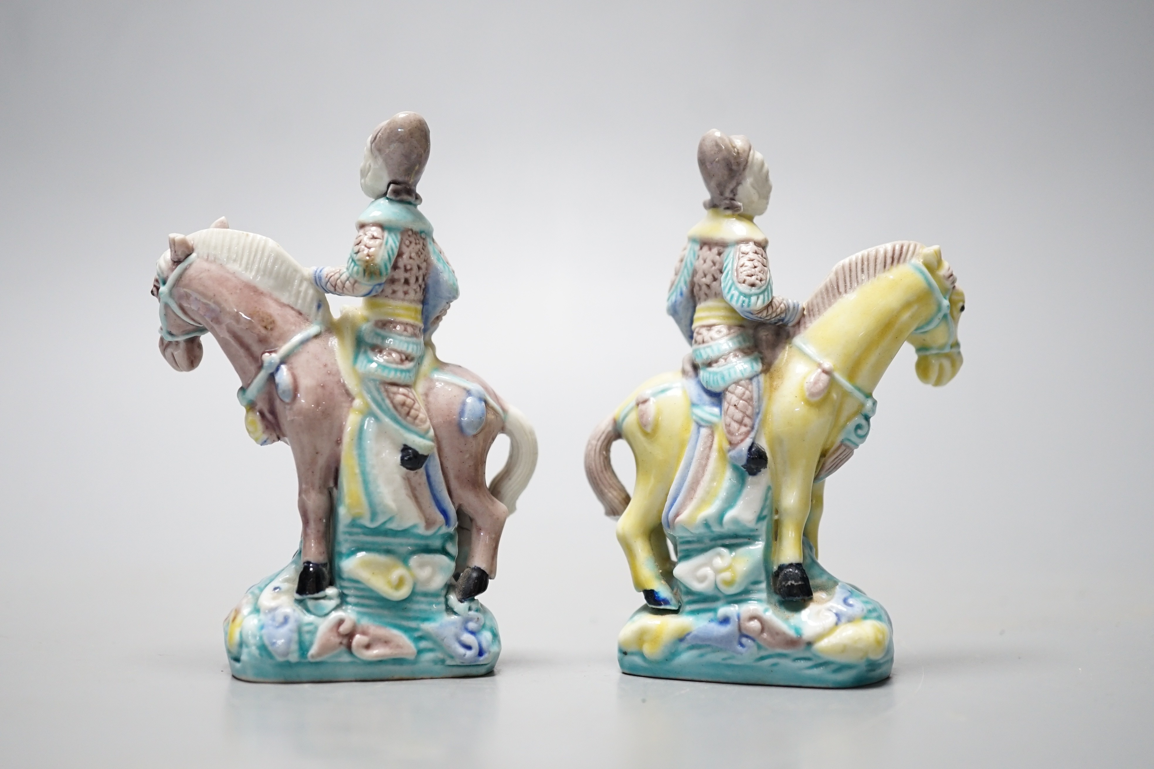 A pair of early 20th century Chinese equestrian groups, 9cm tall